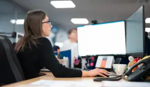 Jenkar team member working at her computer
